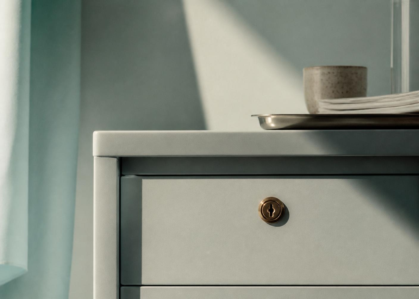 A locked medical records cabinet drawer in soft daylight